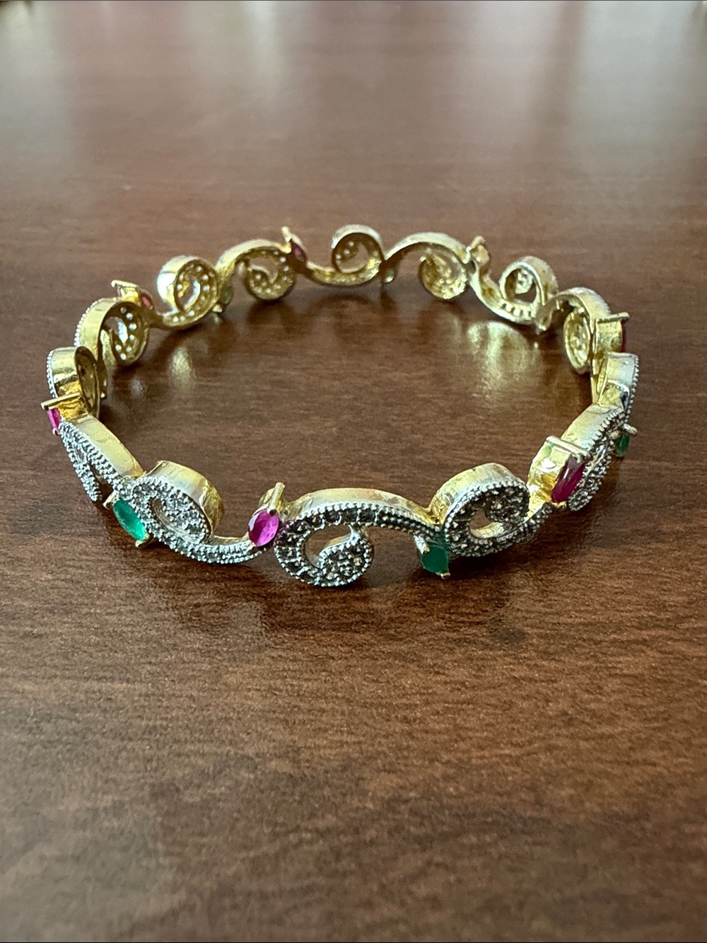 Like new exotic 14K gold plated bangle bracelet with rubies and emeralds (?)